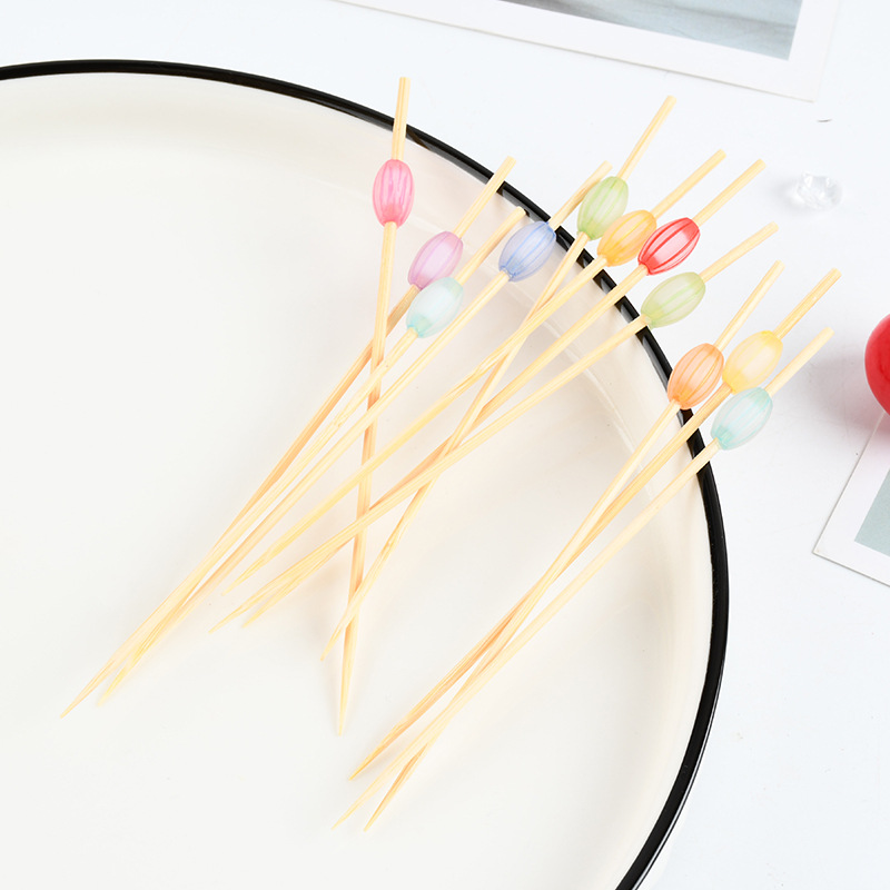 Mayorista en línea coloridas perlas de fruta stick artístico desechable bambú colorido perlas de pastel stick stick sushi