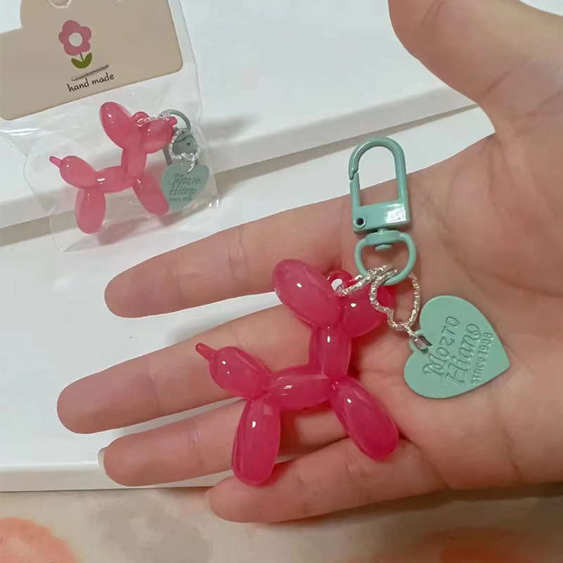 Pequeño Libro Rojo mismo lindo jalea globo láser perro llavero colgante colorido cachorro de dibujos animados teléfono llavero