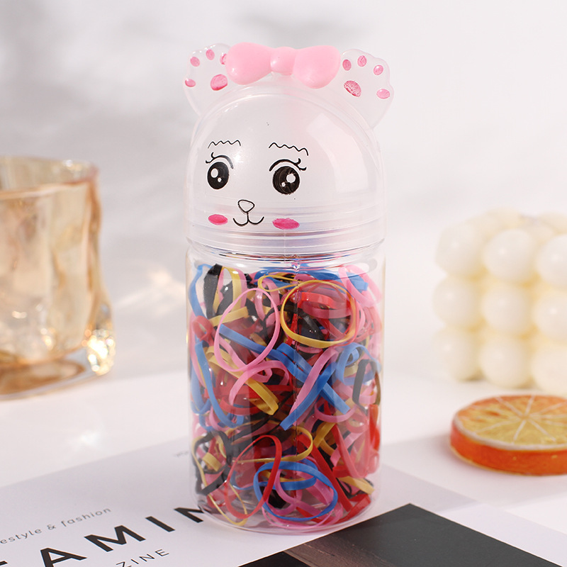 Caja de dibujos animados para niños pequeños tiras de goma coloridas tiras de goma desechables engrosadas de tracción de anillo de pelo adornos para el cabello