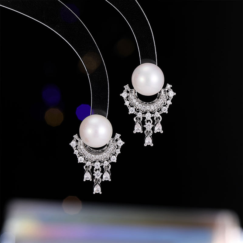 Elegant small sophisticated earrings drop-shaped with tassels from…