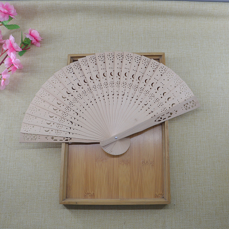 8-inch Full Punch Incense Fan Imitation Sandalwood Fan Sunflower Hollow Folding Fan Wedding Return Wooden Gift Fan display picture 1