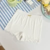 White trousers with bow