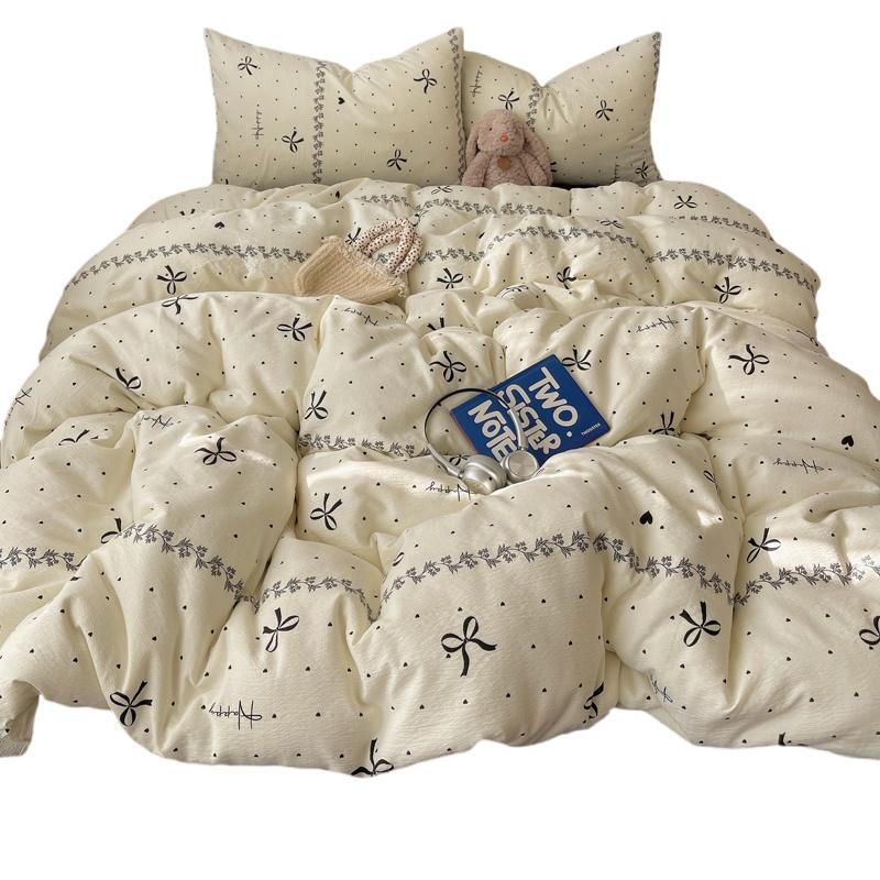 Minimalistisch beddengoedset van gaas met strikjesprint_voghion.com