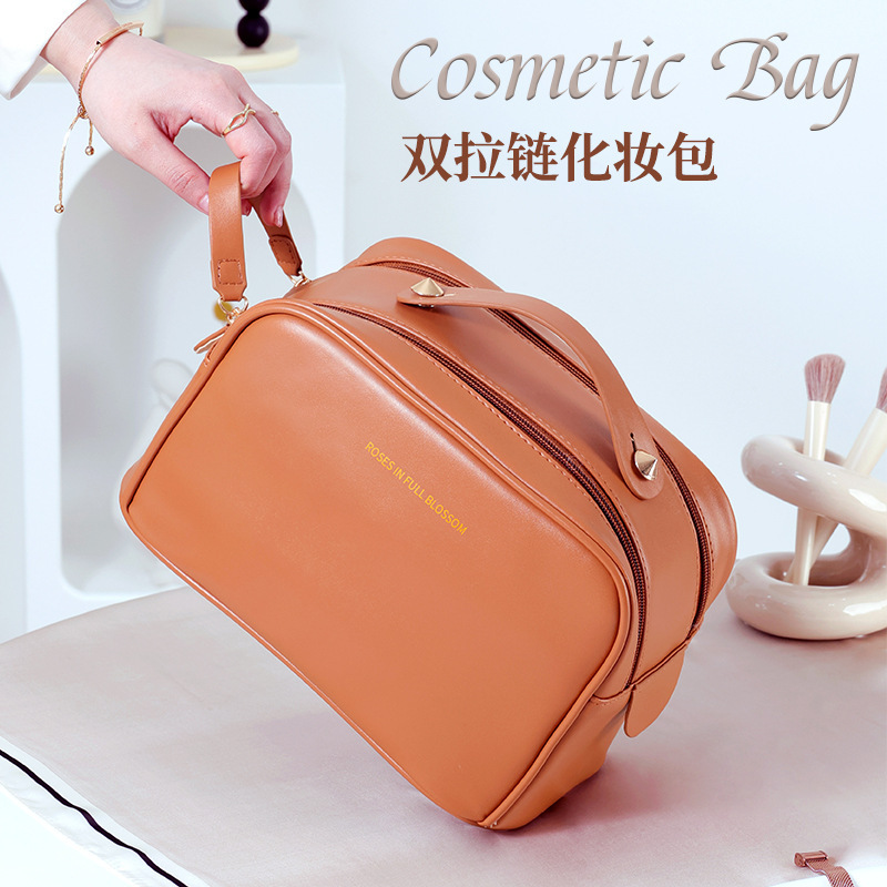 Waterproof handheld cosmetic bag for traveling