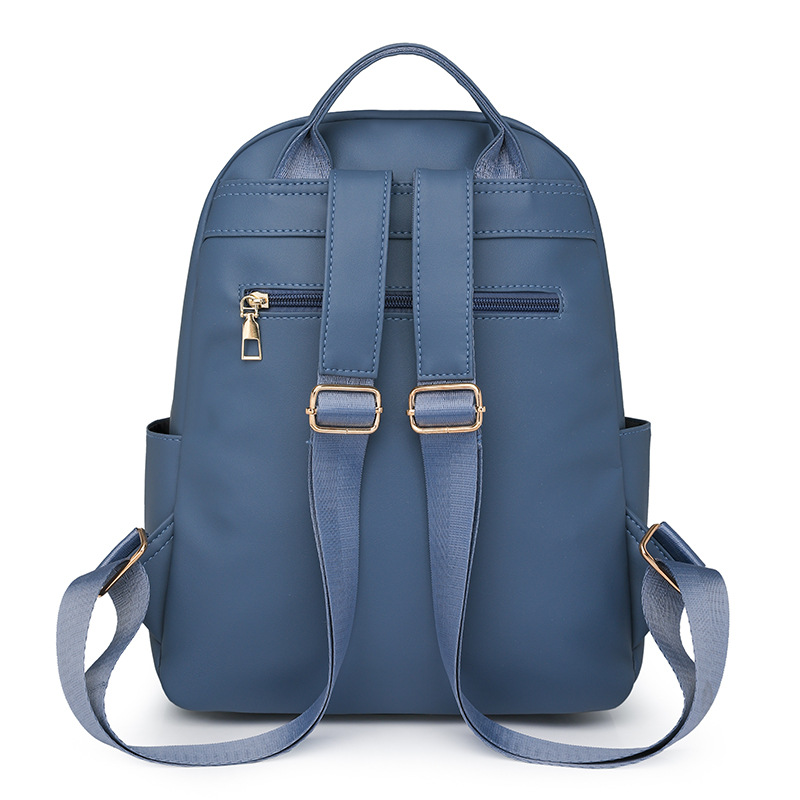 Spot al por mayor 2025 primavera nuevo estilo color sólido mochila para mujer moda urbana viajero ligero mochila escolar