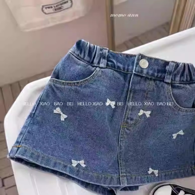 Qian Qi ropa infantil nueva falda de mitad de verano niñas bordadas con arco lavado con agua vaquero estilo extranjero A falda de mitad de mitad de mitad