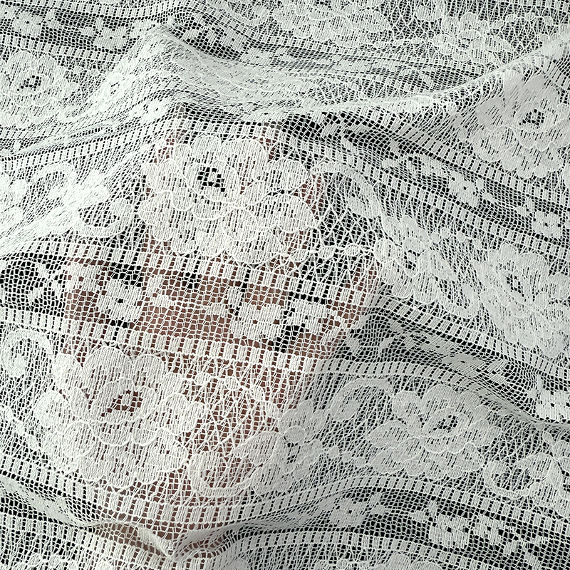 2026 primavera y verano nuevo sentido de diseño floral agujero chaqueta vestido de base ropa de mujer tela de encaje spot