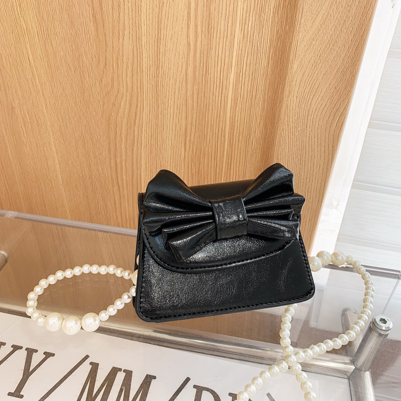 Coreano estilo extranjero mini niñas bolso de hombro lindo arco bebé mochila nueva moda bolso de cadena para niños