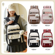 休闲简约轻便双肩包大容量玩偶挂件初中高中学生书包女情侣旅行包