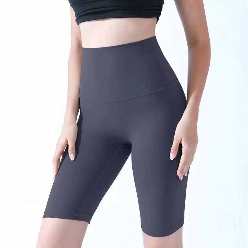 Pantalones cortos desnudos de mujer elásticos apretados para elevar las caderas de cinco puntos pantalones deportivos de secado rápido succión de sudor entrenamiento para correr fábrica de comercio de ping