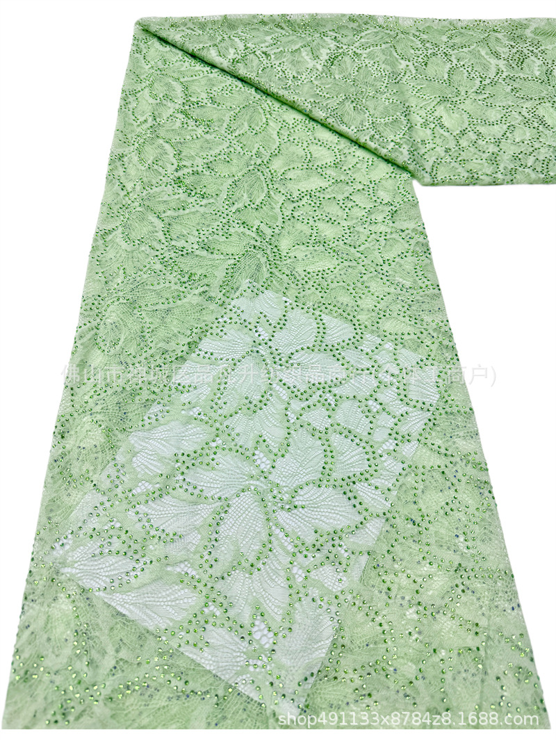 Nuevo hueco flor de encaje fondo tela de perforación caliente pesada cola de pez vestido de boda vestido de noche brindis tela spot