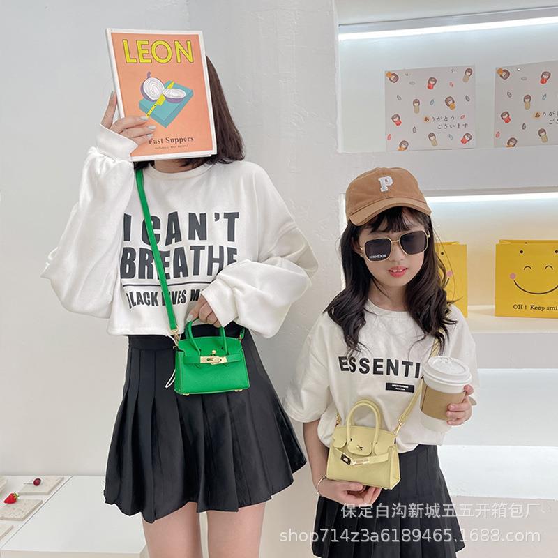 Bolsa para niños nueva pasarela europea y americana moda bolsa de platino estilo occidental niña bolsa de mensajero forma cóncava monedero comercio exterior