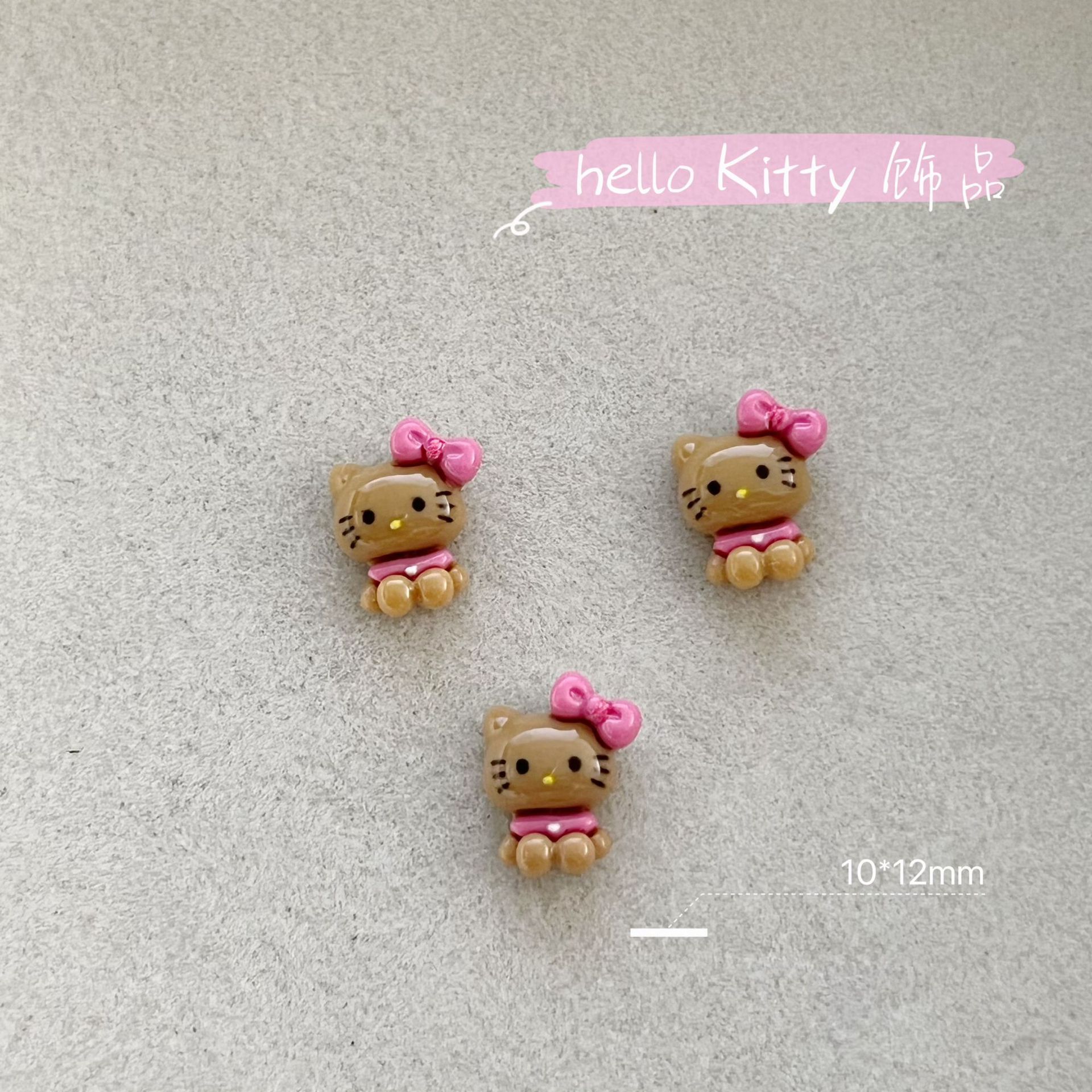 新商品のキティキャットの三麗鴎のネイルアクセサリーのネットの赤い爆発の樹脂のかわいいkt猫は甲を着て飾ります。