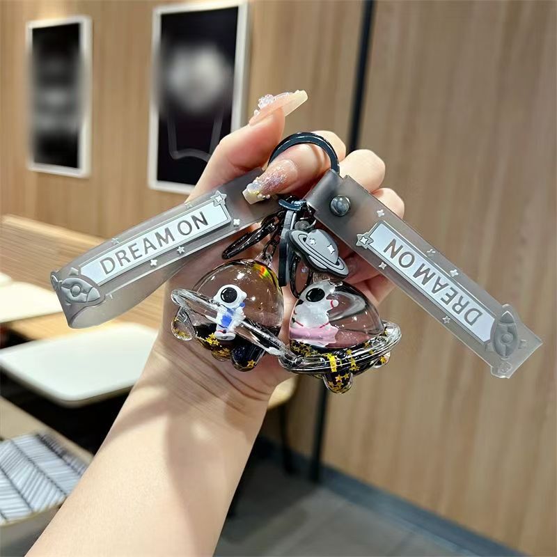 Creative drift bottle black gold spaceship oil keychain cute floating liquid astronaut quicksand bottle pendant