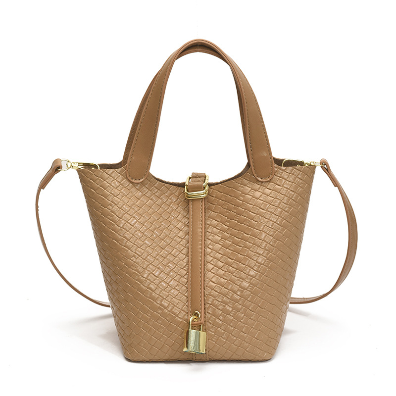 Bolso de cubo portátil con patrón tejido para mujer 2025 nuevo estilo coreano de lujo ligero de alta gama bolso de mensajero para niños de nicho