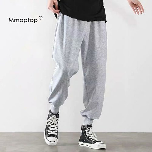 Summer lightweight pants for men: trendy gray ankle-banded, loose-fit sports basketball sweatpants—versatile, knitted, and cropped.