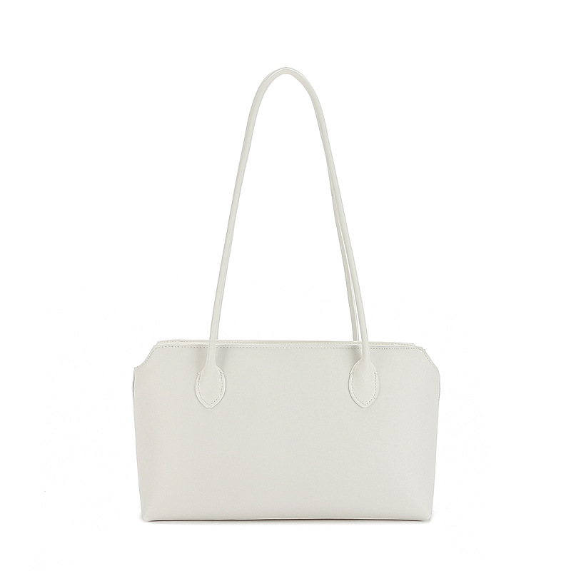 Row 2025 primavera y verano la piel es extremadamente simple, el viento está lleno de bolsos tote bolsos axilas de gran capacidad bolsos de cuero de vaca mujeres