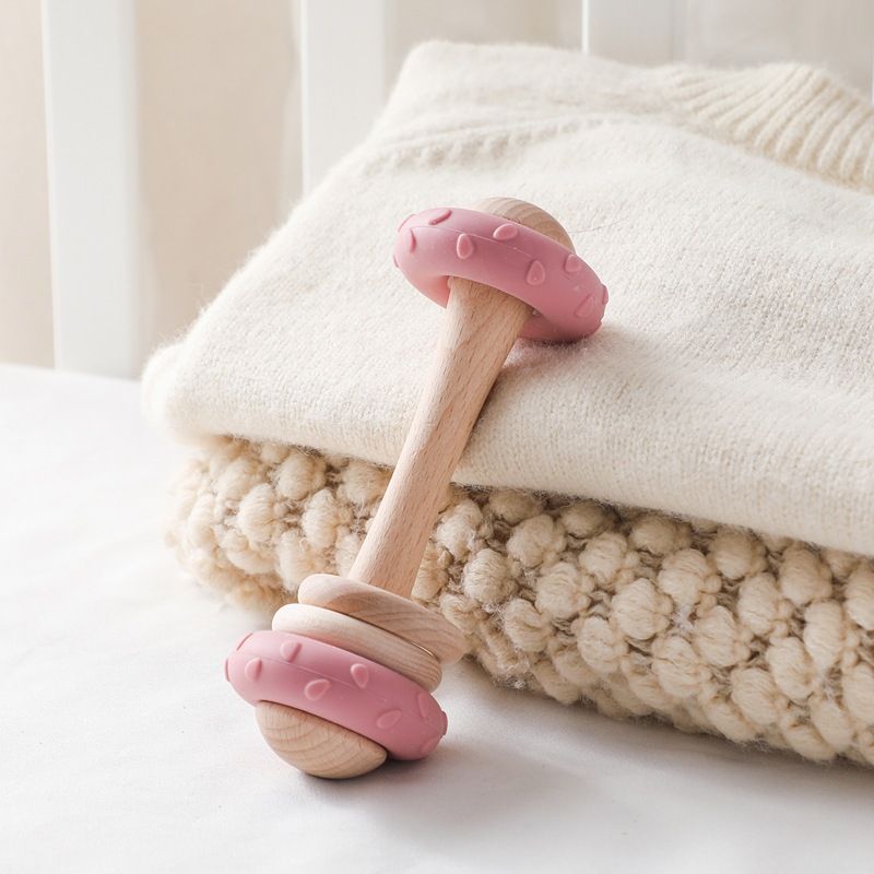 El nuevo sonajero de mano de silicona de madera de Amazon, el bebé puede agarrar la educación temprana