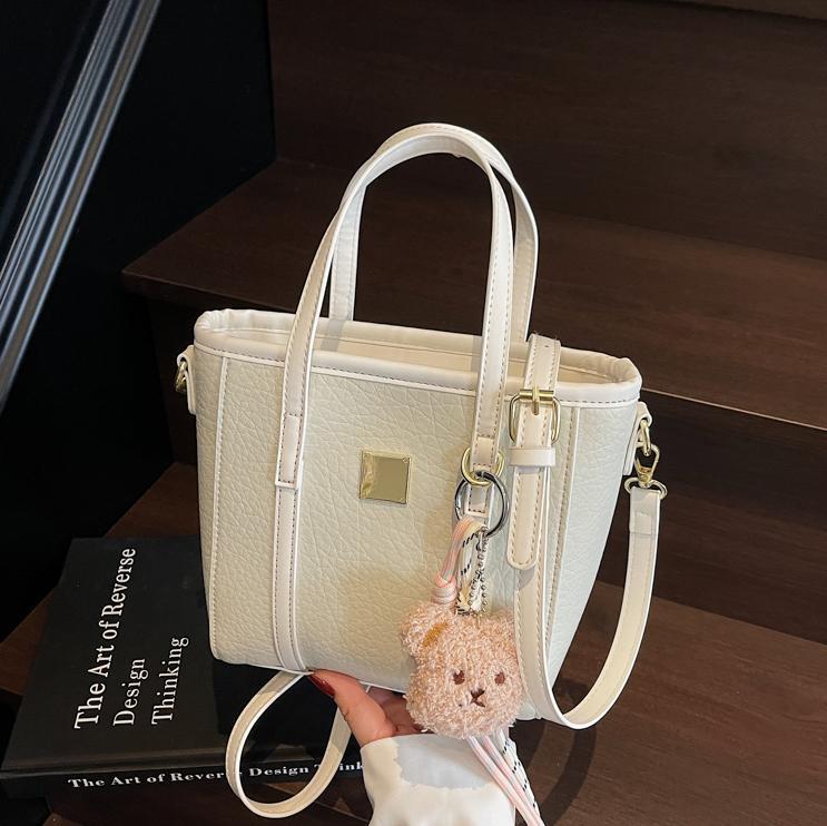 Bolsa de cubo de mano de comercio exterior para mujeres 2025 nuevo nicho de diseño exterior bolso de hombro de estilo universal bolso de mochila de moda casual