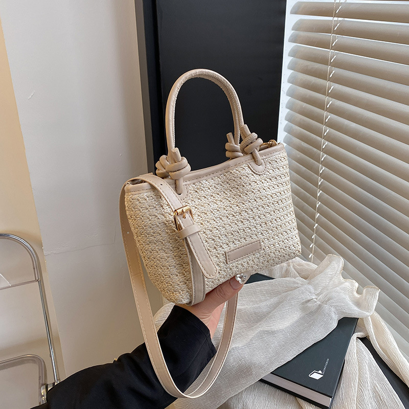 Bolso tejido estilo playa de vacaciones de primavera y verano bolso de mensajero portátil 2025 nuevo estilo nudo de cuerda de aire extranjero bolso de canasta de verduras bolso tejido