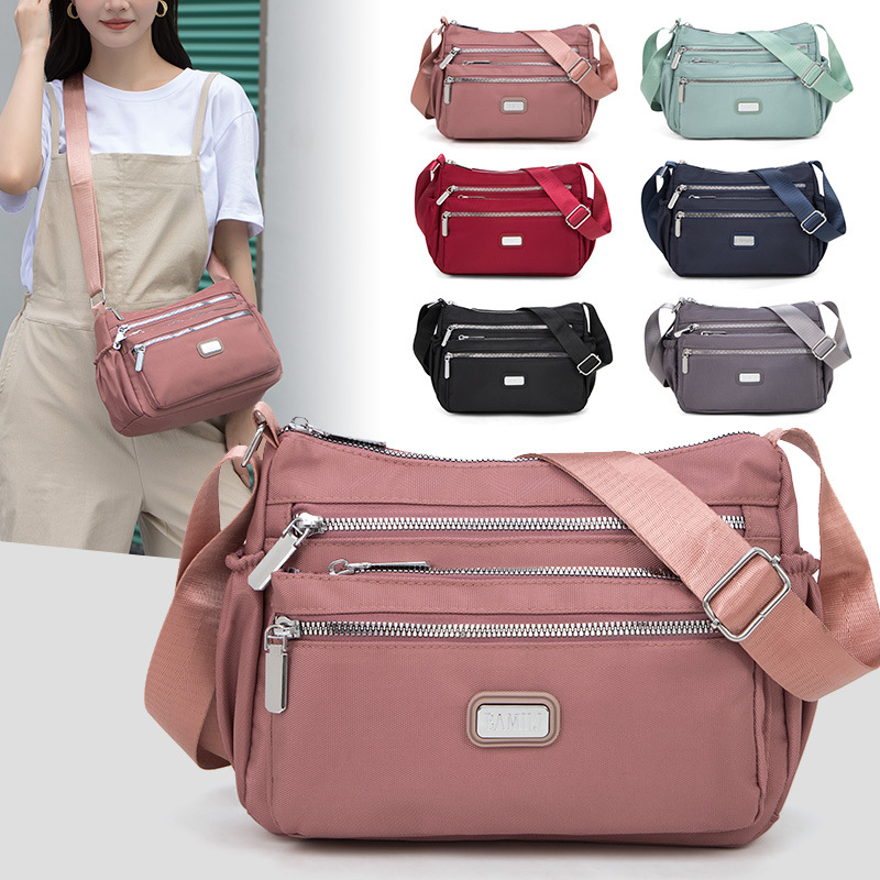 Bolso bandolera de tela Oxford para mujer 20247 nuevo bolso de mujer de mediana edad, bolso de madre de nylon de viaje de gran capacidad, todo fósforo