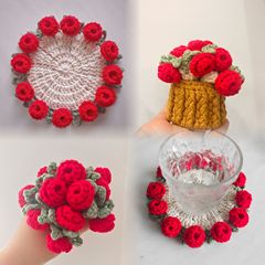 完成品の手作りのバラの花束のコースターの毛糸のかぎ針は杯を編みます。