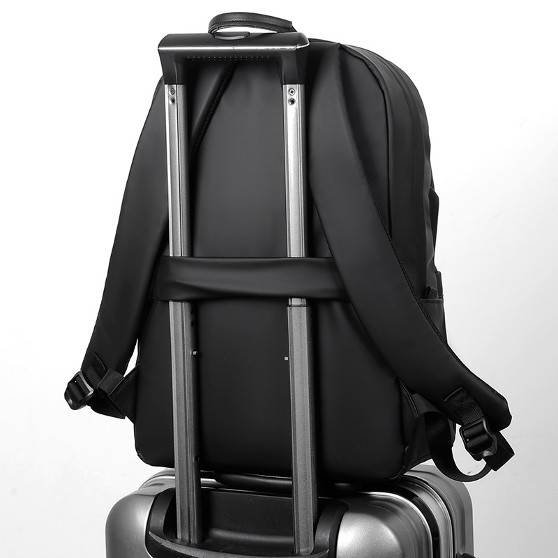 A new minimalist backpack for men, a Korean-style casual and fashionable backpack for laptops, with a logo printed on it Application Scenario