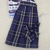 Purple colored mini-skirt, bow tie