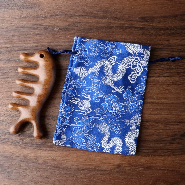 There are hole dolphins massage comb+silk bag