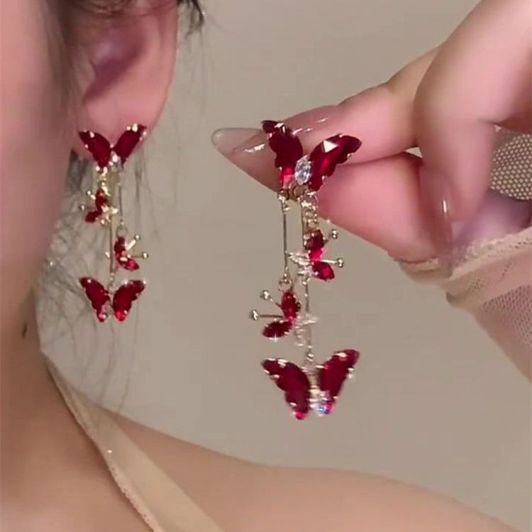 真珠のツバキの花の蚊帳の耳のクリップの耳の穴がない女性の新型の高級感の花のフランスの気質のイヤリング
