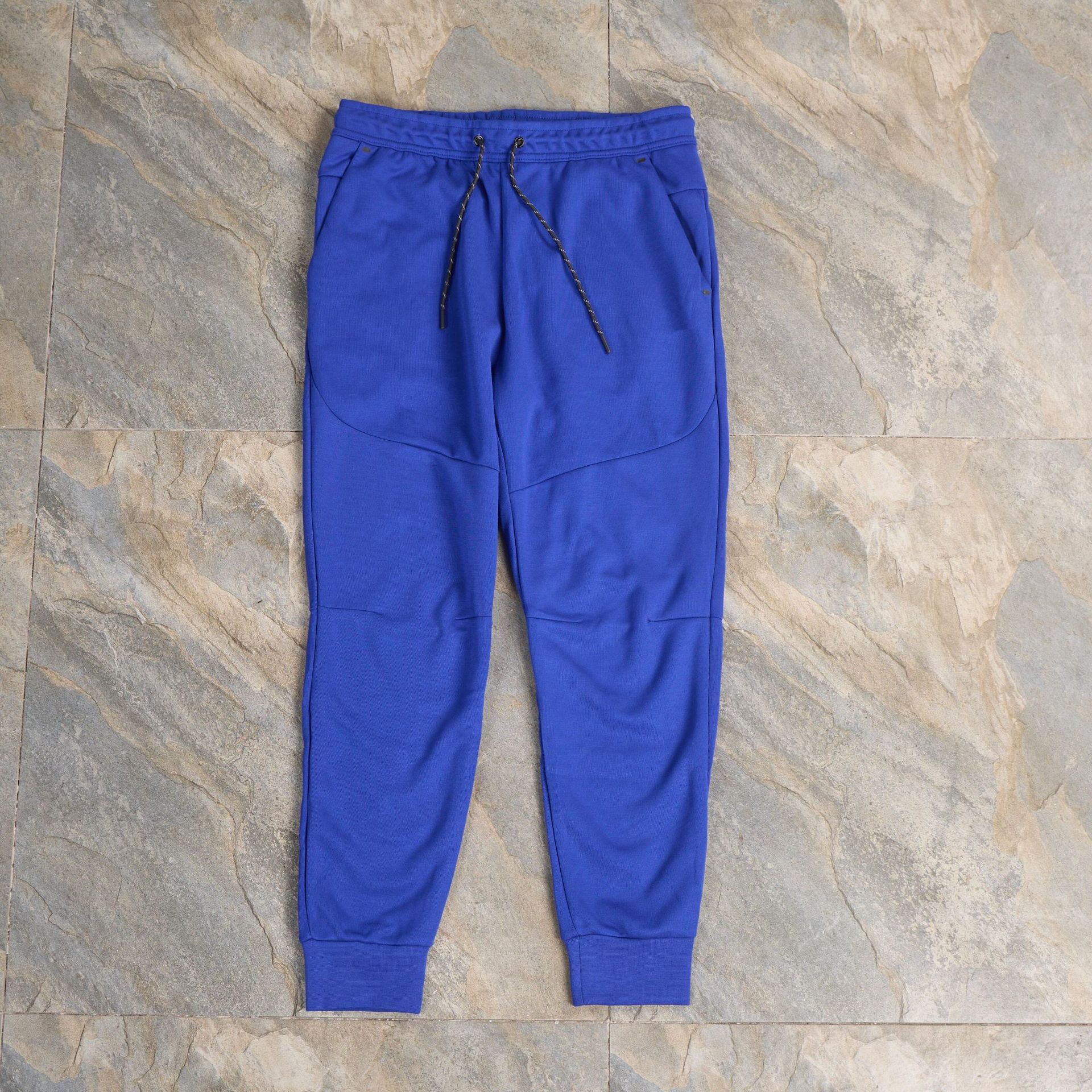 Pantalones casuales deportivos primavera y otoño aire laminado de algodón con cremallera pantalones deportivos para hombres y mujeres
