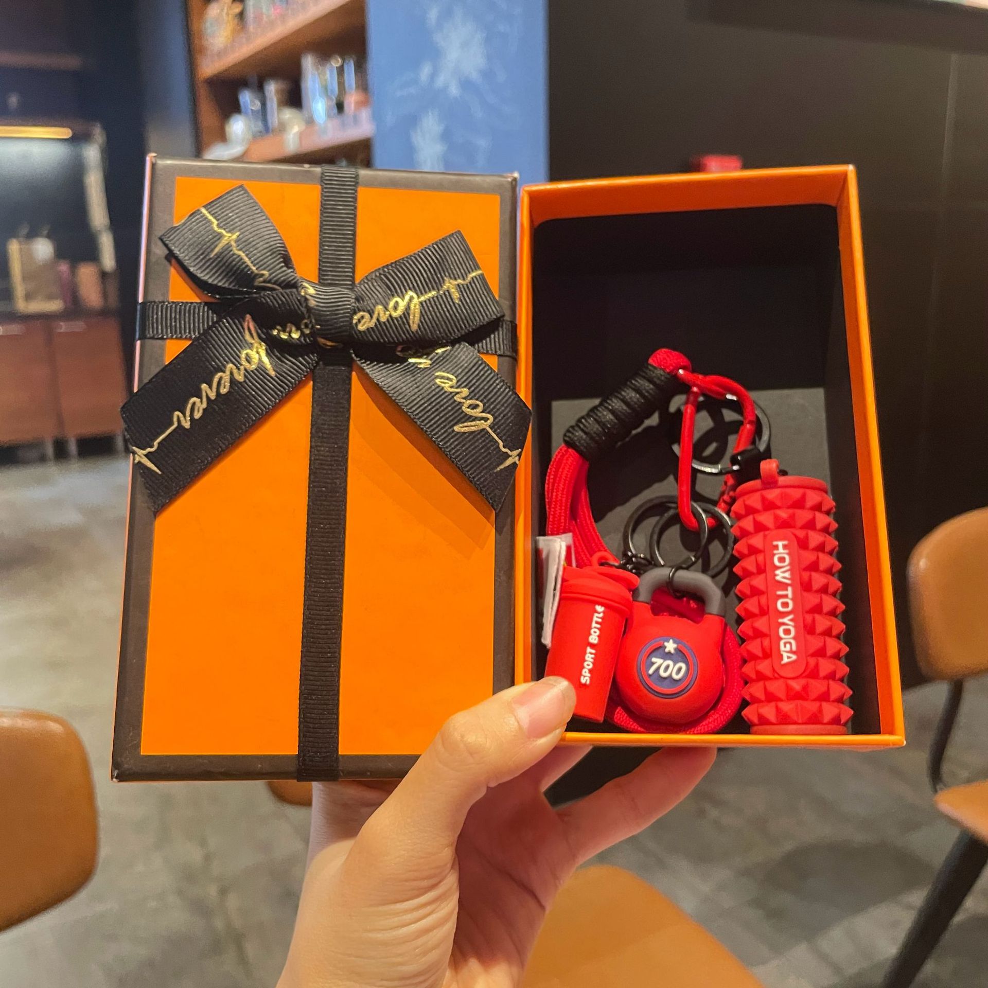Red set for yoga from foam, orange gift box