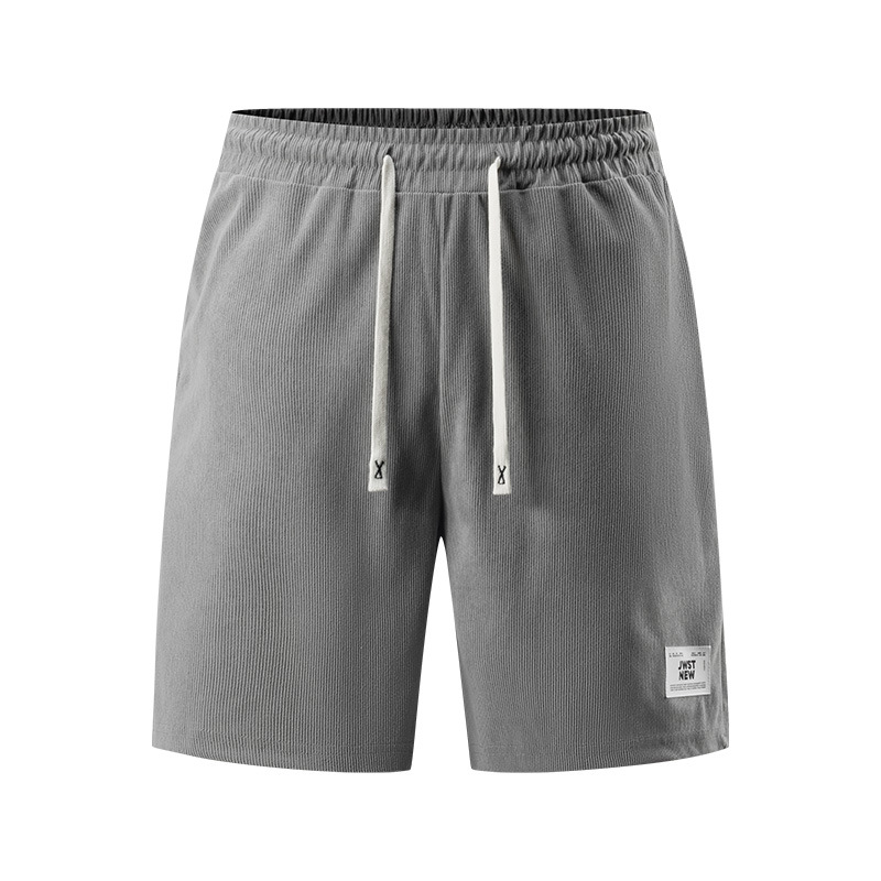 Pantalones europeos de primavera y otoño transfronterizos pantalones deportivos relajados de gran tamaño pantalones deportivos casuales de moda juvenil con cinco puntos fuera