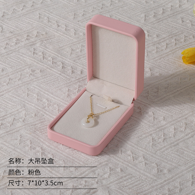 Caja de joyería rosa de alta calidad de cuero pu caja de embalaje de marca de joyería logotipo colgante pulsera collar caja de anillo