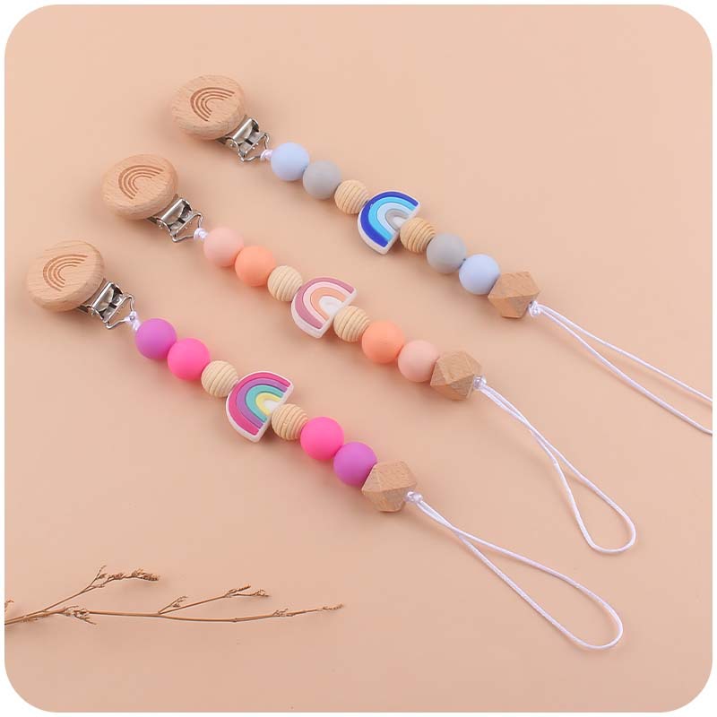 Nuevo bebé suministros dibujos animados silicona Arco Iris mordedor calmante bebé chupete cadena coche colgando mordedor conjunto de cuatro piezas