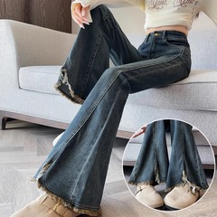 レトロなフォークの毛の縁の小さいラッパのジーパンの女性の2025年の春秋のベルベットのナシの型の体つきのノスタルジックな馬蹄のスピーカーのズボン