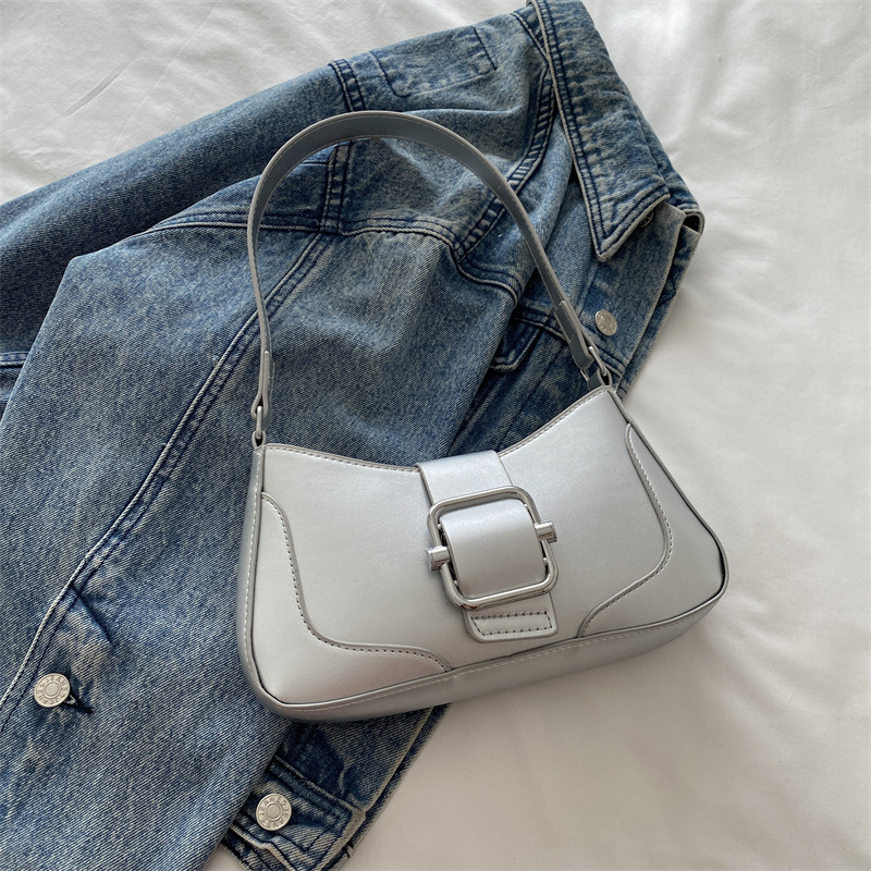 Versión coreana del bolso de axila de alta gama, popular de este año, bolso de palo francés de estilo occidental, diseño de nicho, bolso de hombro de temperamento de moda, viaje