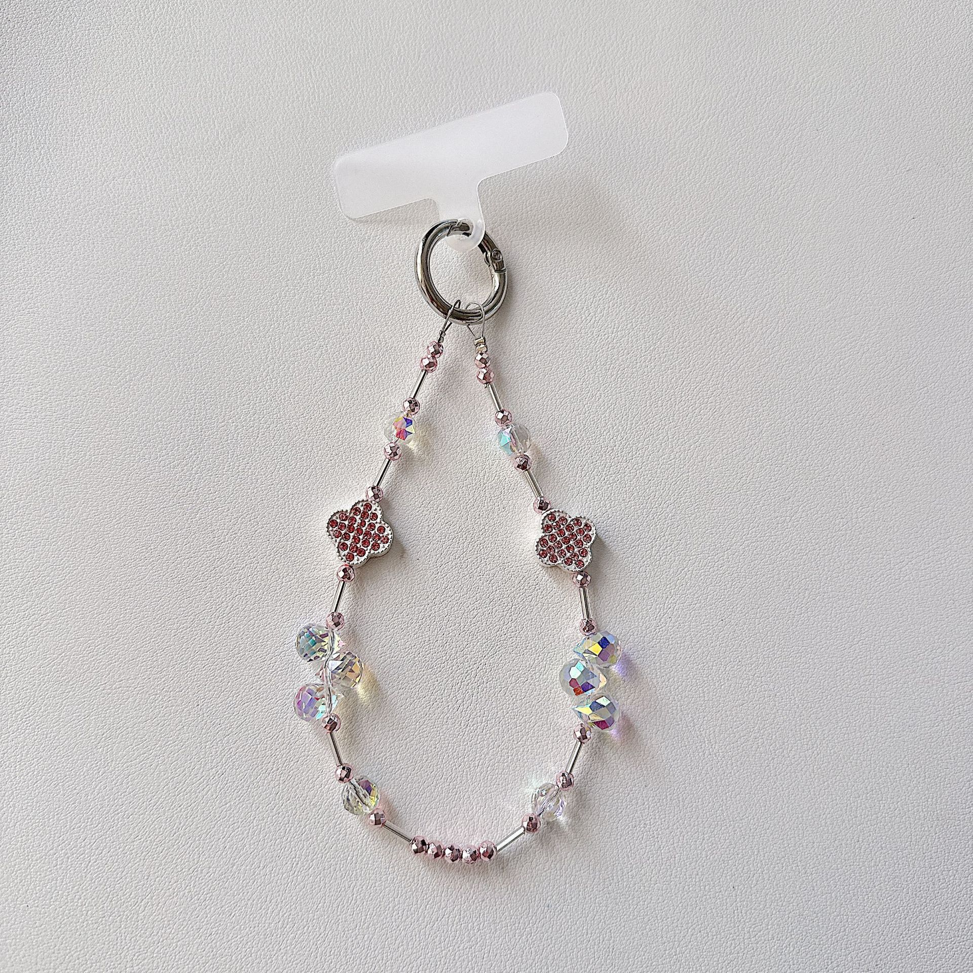 Cadena de teléfono móvil de alta gama hecha a mano boutique, cadena de muñeca de trébol de cuatro hojas de diamantes de lujo femenino, cadena de teléfono móvil de moda, sección corta