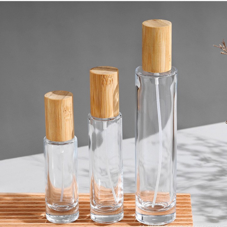 厂家直供18螺口圆柱香水玻璃空瓶竹木盖按压喷雾细雾简约便携厚底