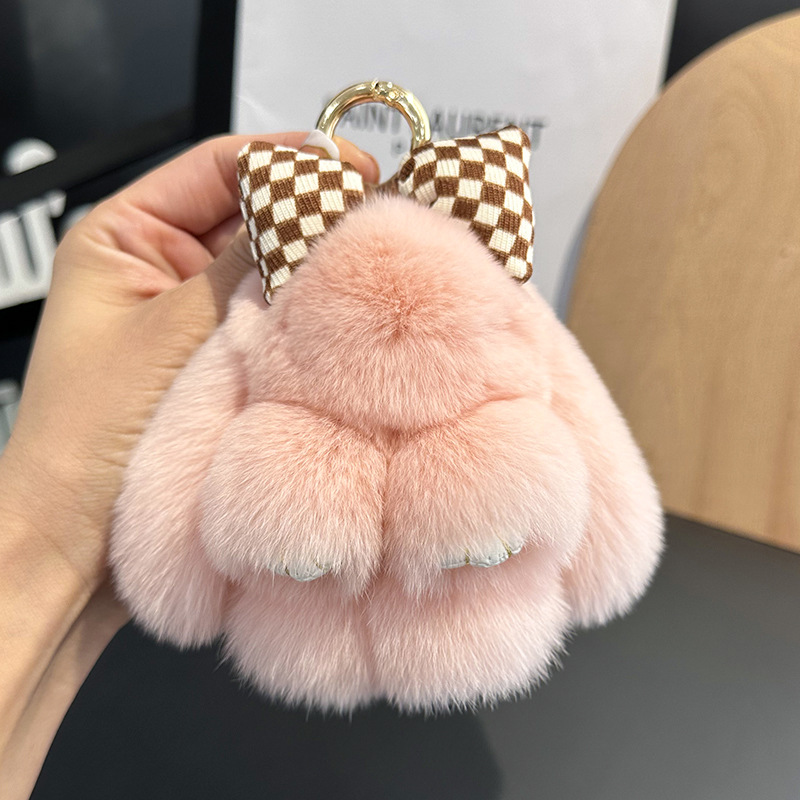 卸売りのかわいいウサギの毛の蝶結びの小さいウサギの自動車のキーホルダーはぬいぐるみのかばんを掛けて飾ります。