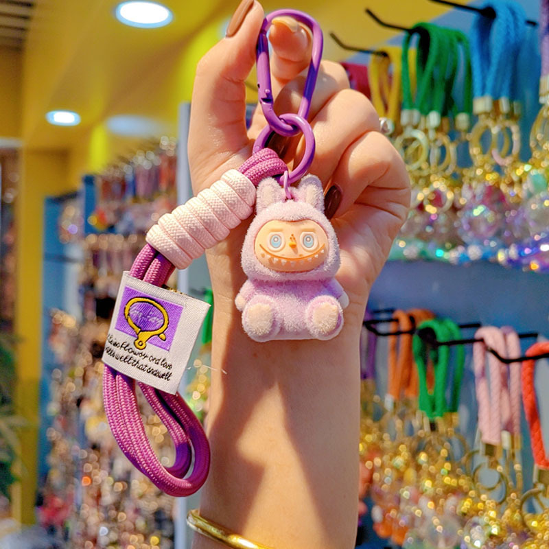 Caricatura floc amarelis llavero de automóvil pareja colgante bolsos creativos colgar garra máquina regalos al por mayor