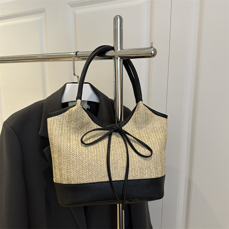 Verano 2025 bowknot axila bolso femenino moda casual bolso de mano de gran capacidad bolso de hombro de color de contraste de paja de nicho
