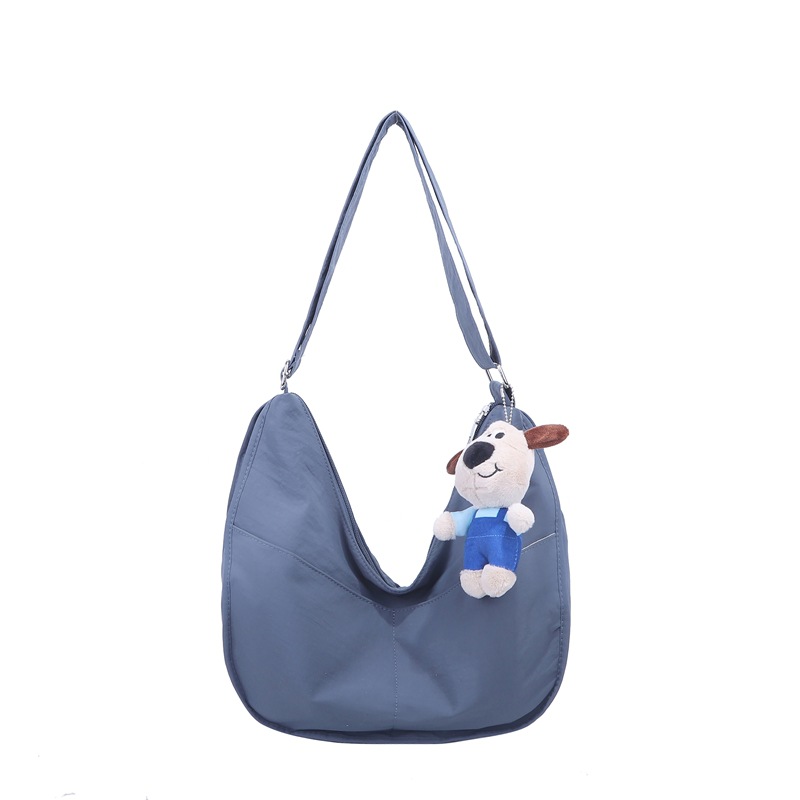 Bolsa de hombro coreana para niños y niñas de color sólido de gran capacidad bolsas de饺os para niños 2025 nuevas bolsas para niños con colgantes