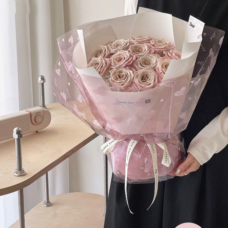 Fábrica de fiestas de flores al por mayor transfronterizo nuevo papel de vidrio amor impresa en papel de embalaje de flores transparentes