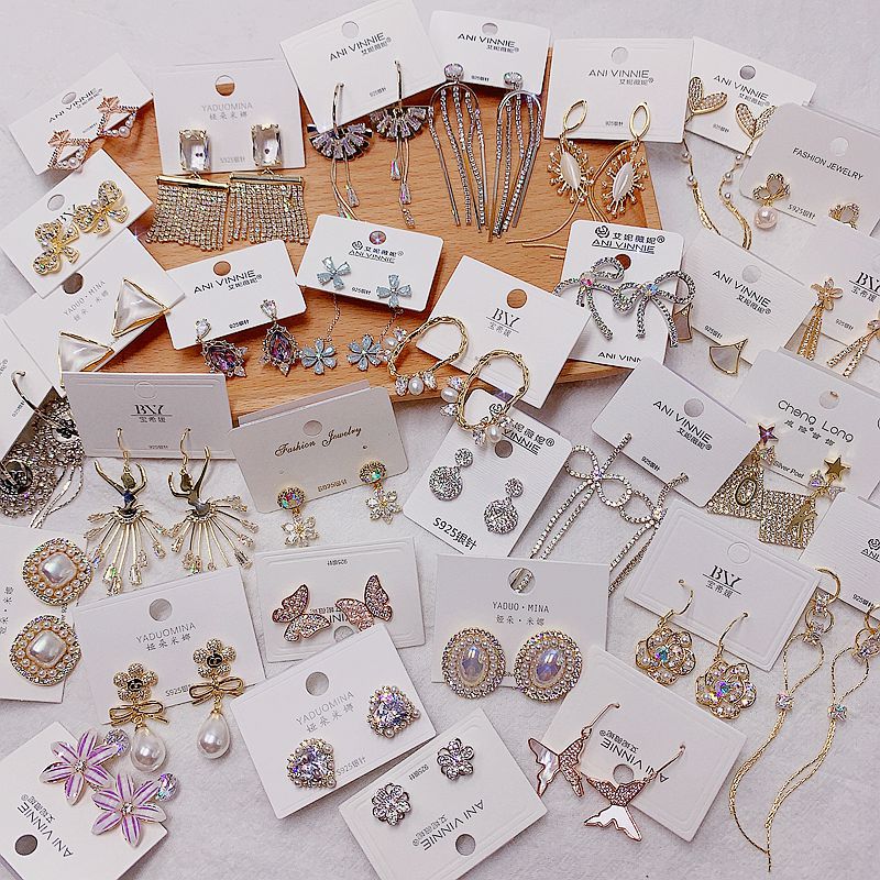 Universal earrings from pearl with zircon
