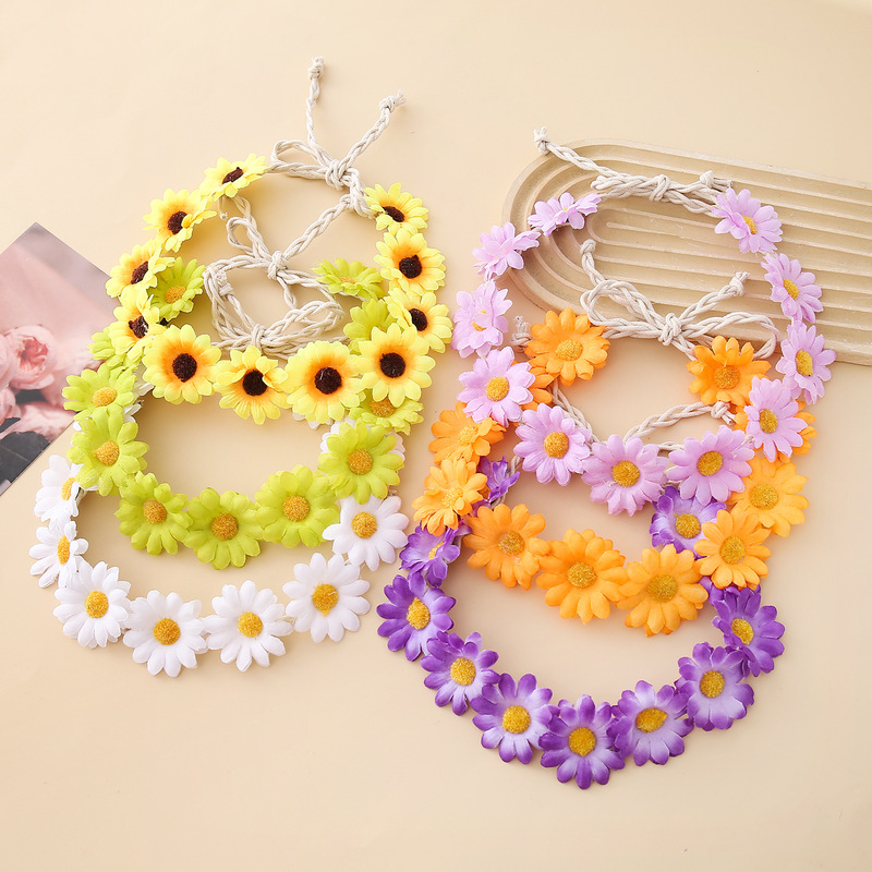 女性の女の子のヘアバンドは11輪の花の頭を編んで小さい太陽の花を持って旅行します。|undefined