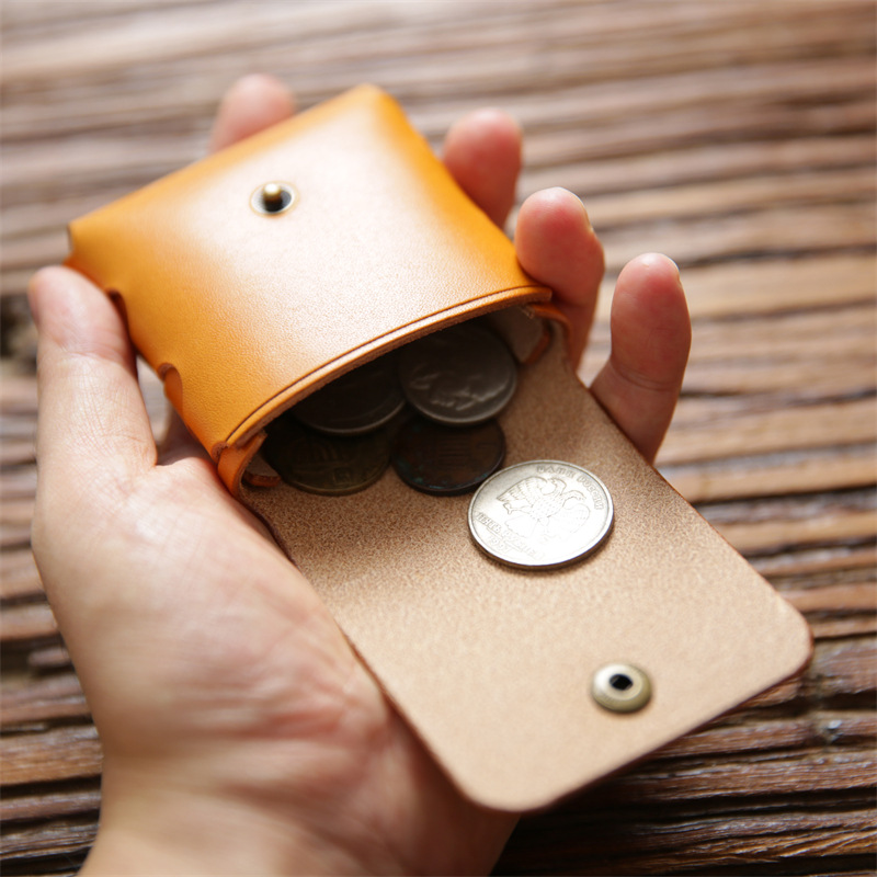 男女のミニ小銭入れは、トップの牛革をなめして、硬貨を掛けて、本革のイヤホンの保護カバーをしています。