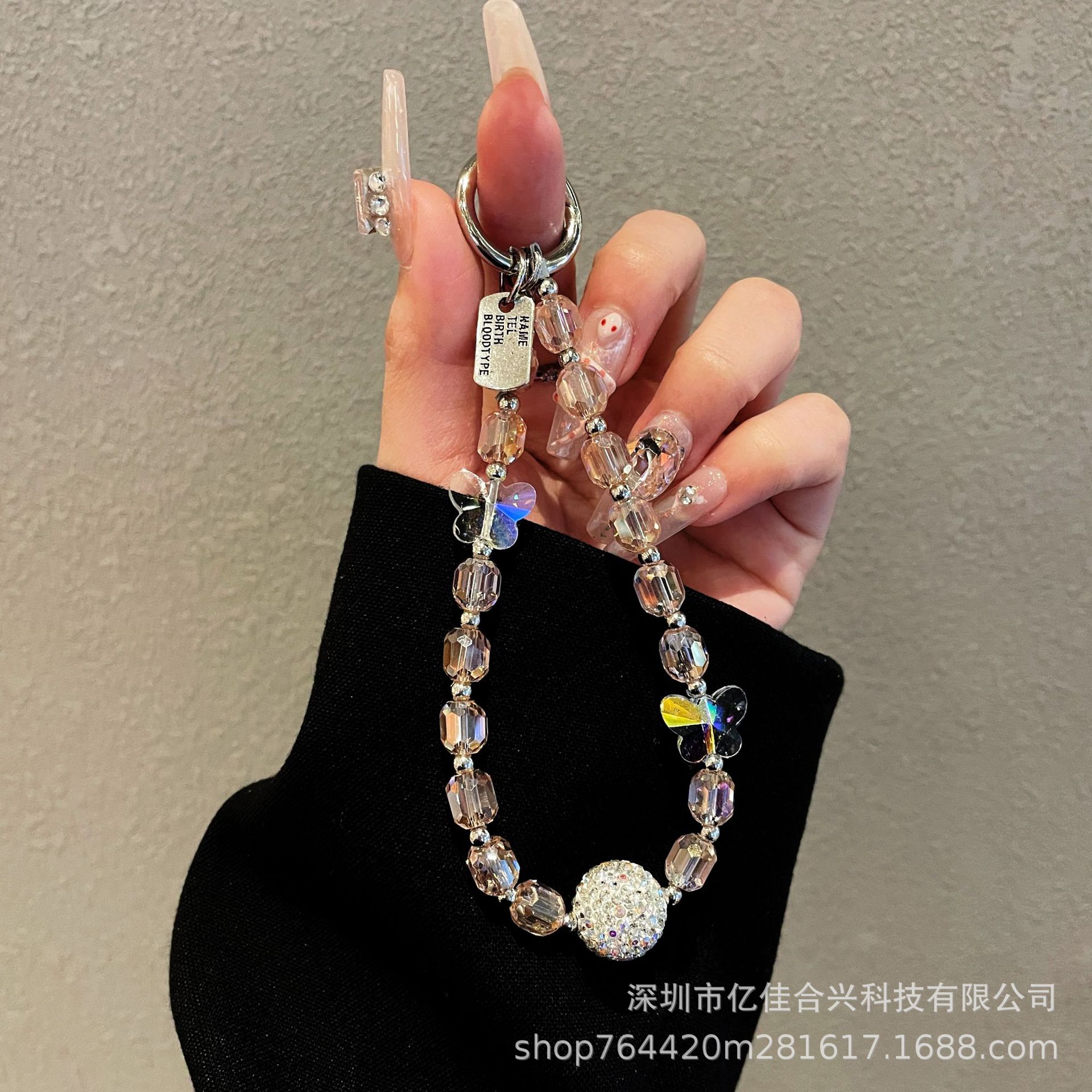 Japón y Corea del Sur estilo transfronterizo nuevo caso de teléfono móvil colgante cadena de cristal string arco de diamante cadena de teléfono móvil colgante de muñeca