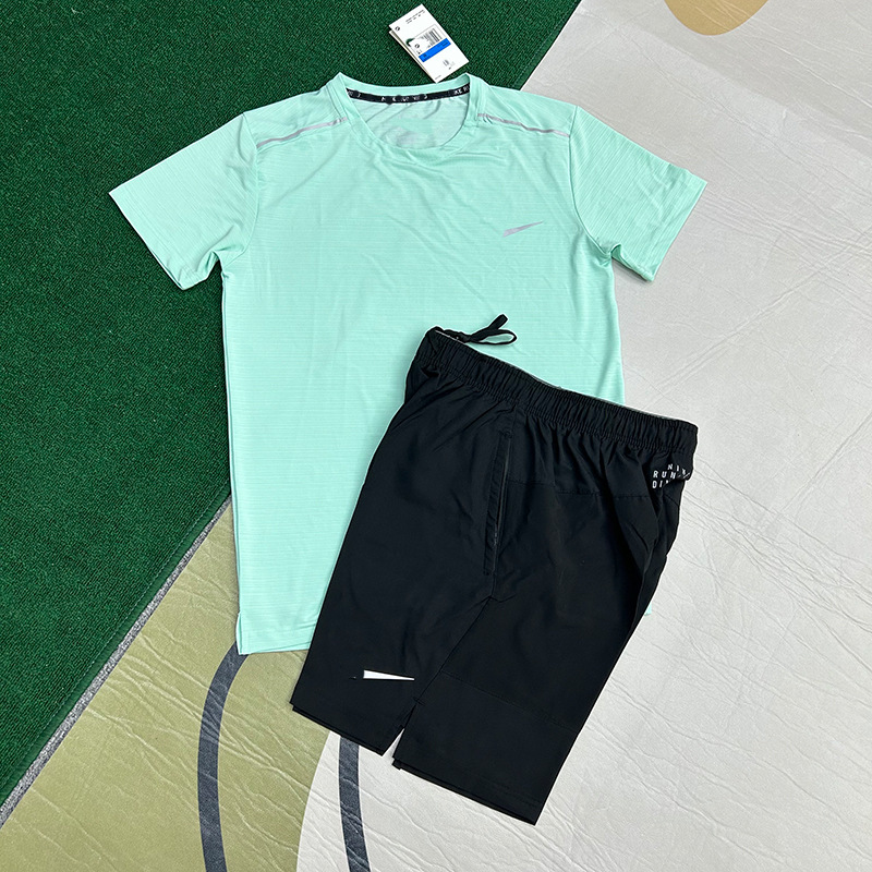 Mayorista nuevo juego de comercio exterior deportivo fitness juego de carrera rápida secado transpirable suelto ocio pantalones cortos de manga corta ropa de hombre
