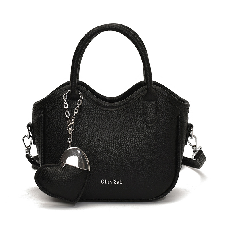 Bolsos pequeños de moda súper calientes de nicho para mujer 2025 nueva tendencia bolsa de cubo de aire extranjero estilo caliente de verano bolso de hombro de mano